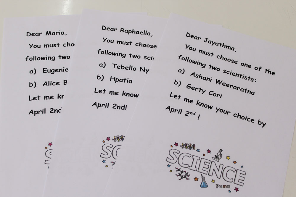 Each student receives a card with the names of two scientists, and must choose one to research.